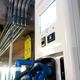 An electric vehicle charging station in a parking garage with the words Evgo Fast charger.